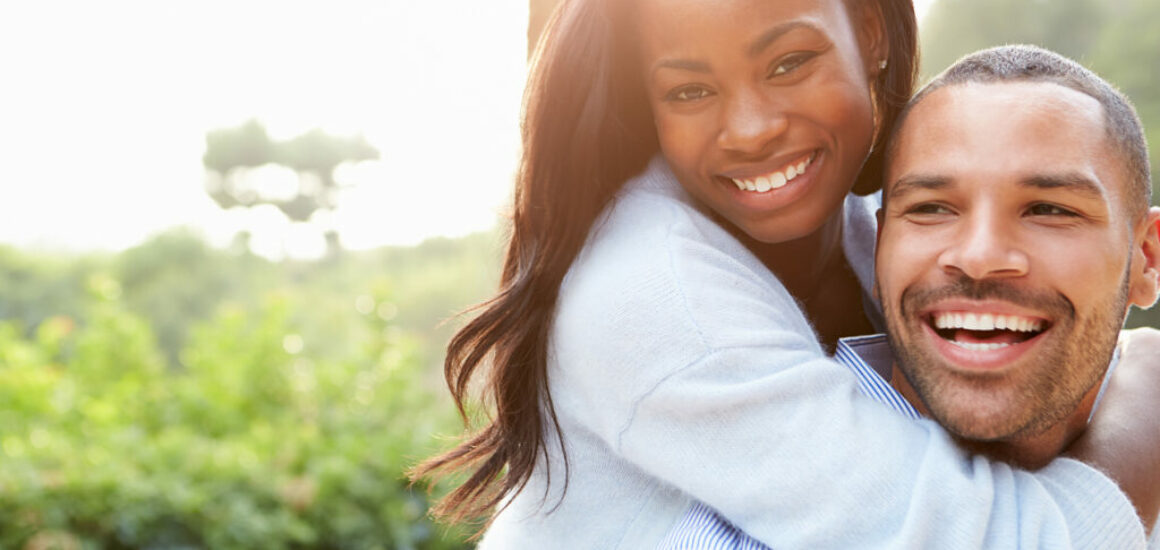 Portrait Of Loving African American Couple In Countryside