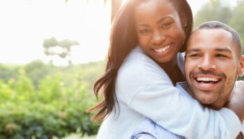 Portrait Of Loving African American Couple In Countryside